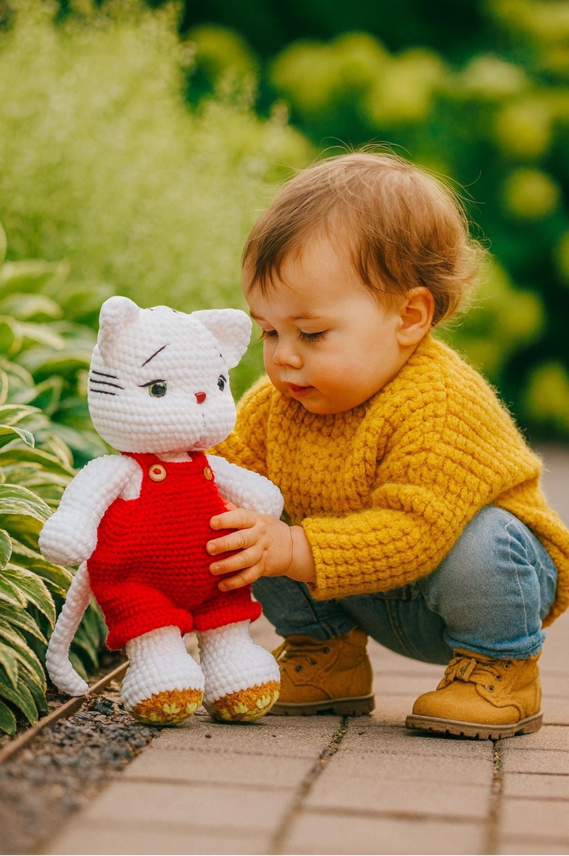 Crochet White Cat Plushie in Red Overalls: Handmade Amigurumi Toy