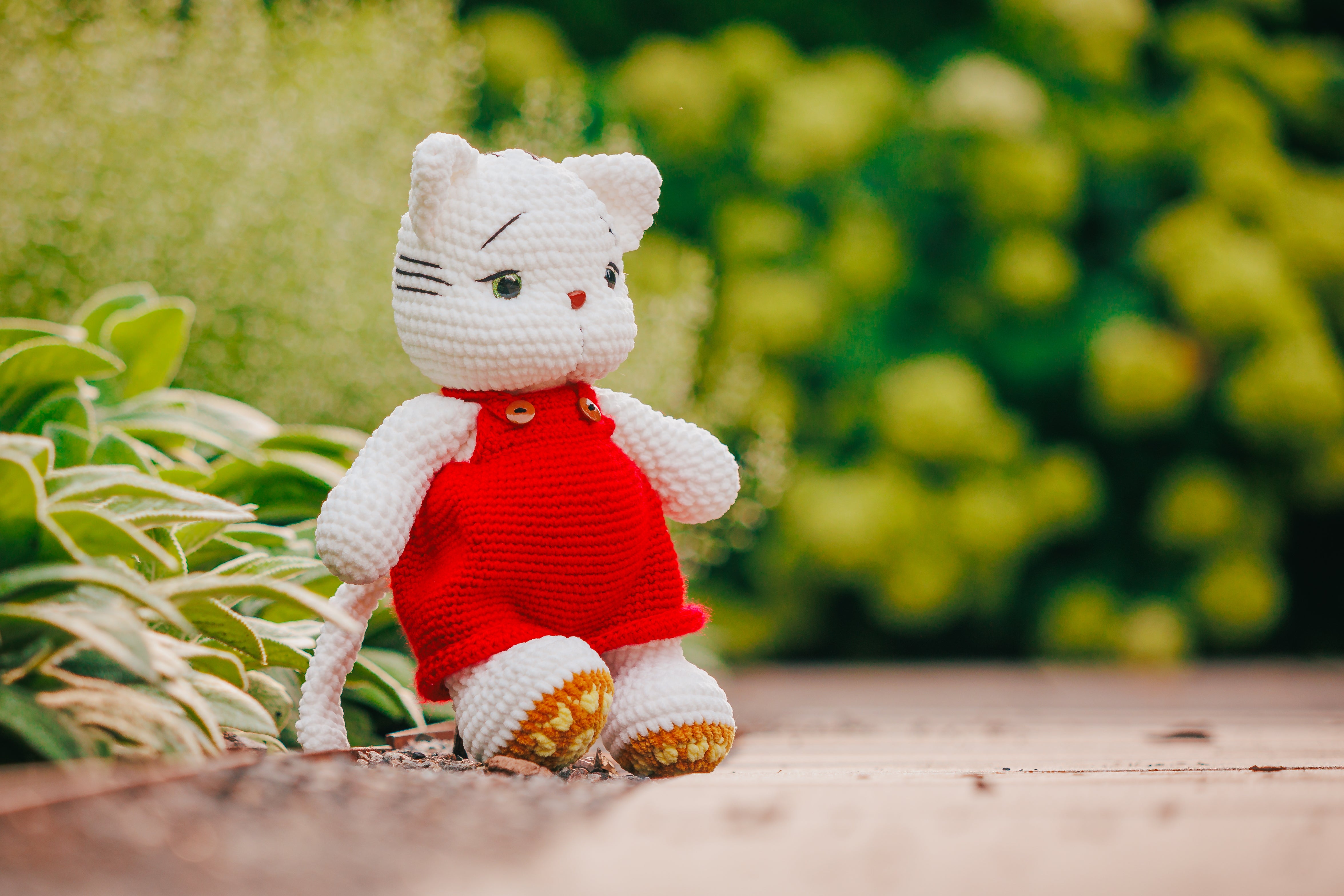 Crochet White Cat Plushie in Red Overalls: Handmade Amigurumi Toy