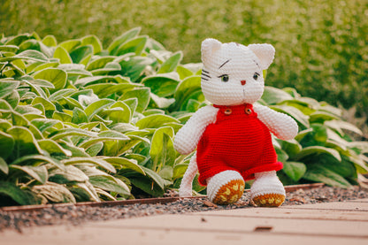 Crochet White Cat Plushie in Red Overalls: Handmade Amigurumi Toy