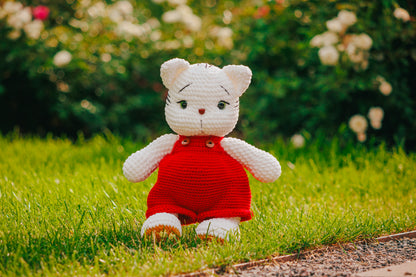 Crochet White Cat Plushie in Red Overalls: Handmade Amigurumi Toy